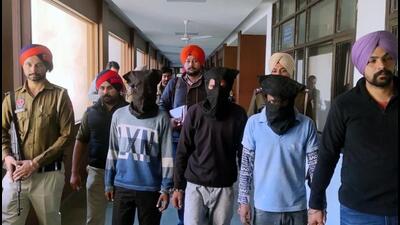 The three murder accused (faces covered) in Bathinda police’s custody at the district administration complex on Wednesday. (Sanjeev Kumar/HT) The three murder accused (faces covered) in Bathinda police’s custody at the district administration complex on Wednesday. (Sanjeev Kumar/HT)