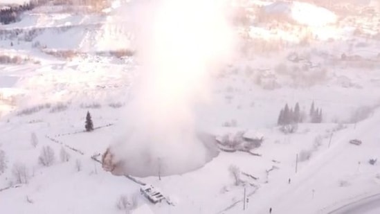 Russia: The huge collapse came at an iron-ore mine with one house seen perched on the edge.