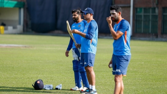 India's captain Rohit Sharma, left, coach Rahul Dravid, center and Rahul Chahar attend a training session ahead of their second one day international cricket match against Bangladesh in Dhaka(AP)