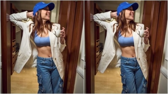 Sharvari added more winter vibes to her look with a white blazer and a bright blue cap. Holding her coffee cup in her hand, she posed for the indoor photoshoot.&nbsp;(Instagram/@sharvari)
