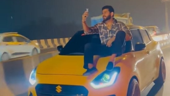 Ranbir in a video that is posted on his Instagram account is seen sitting on the bonnet of a 'yellow Swift'. (source: Instagram/utkarsh_solankii)