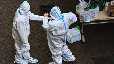 Covid In China: Security guards at the entrance of a compound under Covid-19 lockdown in the Jing'an district in Shanghai. (AFP) Covid In China: Security guards at the entrance of a compound under Covid-19 lockdown in the Jing'an district in Shanghai. (AFP)
