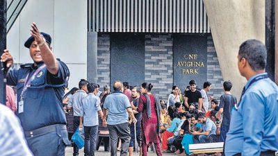 Residents of One Avighna Park assemble in the compound of the building (Satish Bate/HT PHOTO)