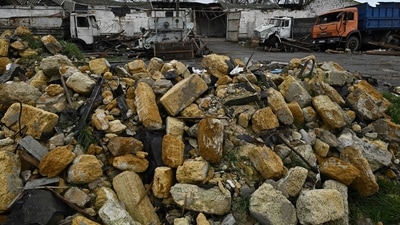 Russia-Ukraine War: Damaged trucks amid debris at a grain storage facility destroyed following missile attack. (AFP) Russia-Ukraine War: Damaged trucks amid debris at a grain storage facility destroyed following missile attack. (AFP)