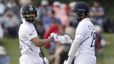 Virat Kohli batting with Cheteshwar Pujara (R) (AP) Virat Kohli batting with Cheteshwar Pujara (R) (AP)