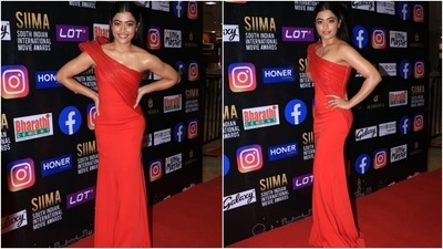 Rashmika Mandanna graced the red carpet of SIIMA awards in a red gown featuring dramatic sleeves.&nbsp; (HT Photo/Varinder Chawla)