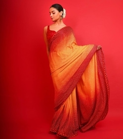Alia Bhatt looks ethereal in a yellow and red dual ombre-toned bandhani saree. (Instagram/@AliaBhatt) Alia Bhatt looks ethereal in a yellow and red dual ombre-toned bandhani saree. (Instagram/@AliaBhatt)