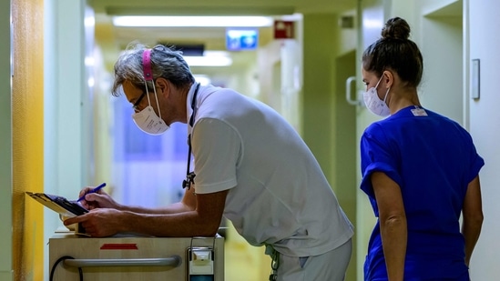 Germany: A doctor checks data in the intensive care unit (ICU) at the pediatric ward of Berlin's Saint Joseph Hospital.(AFP)