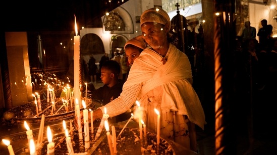 An Ethiopian woman and her child visit the Church of the Nativity in the West Bank town of Bethlehem.(AP)