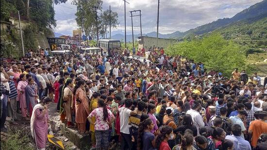 People block the Rishikesh-Badrinath highway in protest against the murder, in Pauri Garhwal district. (PTI)