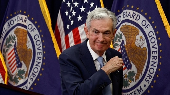 Federal Reserve Board Chairman Jerome Powell leaves after a news conference following the announcement that the Federal Reserve raised interest rates by half a percentage point, at the Federal Reserve Building in Washington.(REUTERS)