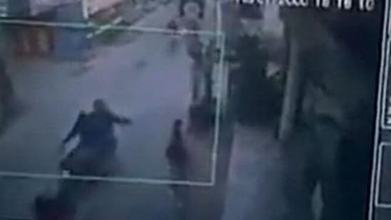 A screenshot of the CCTV footage shows two bike-borne men throwing acid on the girl. (Screengrab/Twitter video/Swati Maliwal)