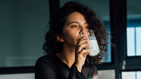 The best way to consume milk is by boiling it first. Garnish with a pinch of shunti/dry ginger powder and some unrefined cane sugar.(pexels)
