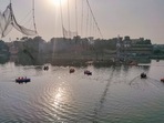 Days after it was reopened following renovation, the suspension bridge on the Machchu river in Morbi town collapsed on October 30, killing 135 people. (PTI)