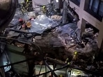 Following the burst of a huge aquarium, the atrium of a hotel is devastated in Berlin Germany.(AP)