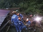Civil Defense personnel search for survivors buried after a landslide hit a campsite in Batang Kali, Malaysia, Friday. Civil Defense personnel search for survivors buried after a landslide hit a campsite in Batang Kali, Malaysia, Friday.