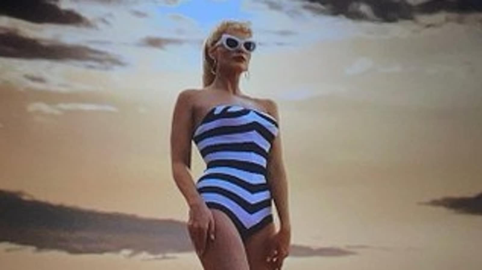 Margot Robbie puts spin on Barbie's iconic 1959 striped swimsuit