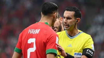 Mexican referee Cesar Ramos speaks with Morocco's defender Achraf Hakimi Mexican referee Cesar Ramos speaks with Morocco's defender Achraf Hakimi