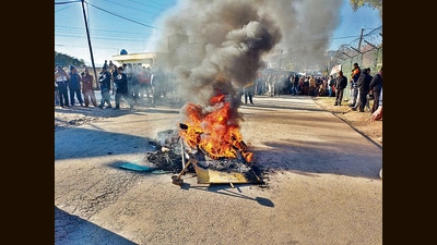 Protesters block the Rajouri-Jammu highway after two civilians were killed in Rajouri on Friday. (PTI) Protesters block the Rajouri-Jammu highway after two civilians were killed in Rajouri on Friday. (PTI)