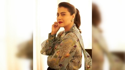 Kajol wore a grey floral sheer top which she teamed with a classic pair of black trousers. (Instagram/@kajol) Kajol wore a grey floral sheer top which she teamed with a classic pair of black trousers. (Instagram/@kajol)