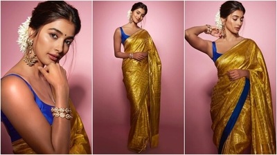 Earlier, Pooja had shared pictures of another traditional look she had donned to promote Cirkus. She draped herself in a gold silk saree and a sleeveless blue-coloured blouse styled with ornate bangles, matching earrings, a centre-parted messy bun, white gajra, and minimal makeup. (Instagram) Earlier, Pooja had shared pictures of another traditional look she had donned to promote Cirkus. She draped herself in a gold silk saree and a sleeveless blue-coloured blouse styled with ornate bangles, matching earrings, a centre-parted messy bun, white gajra, and minimal makeup. (Instagram)