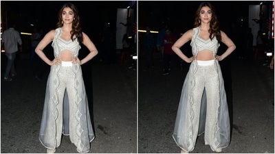 Pooja accessorised the embellished ivory outfit with minimal accessories, including embroidered white juttis, statement rings, and dangling earrings. (Instagram) Pooja accessorised the embellished ivory outfit with minimal accessories, including embroidered white juttis, statement rings, and dangling earrings. (Instagram)