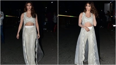 Pooja's ensemble for the promotional event features a sleeveless bralette-style blouse. It comes with a plunging V neckline, intricate silver gota patti embroidery, tassel embellishments on the asymmetric hem, sequin and thread work, a fitted bust, and cropped midriff-baring silhouette. (Instagram) Pooja's ensemble for the promotional event features a sleeveless bralette-style blouse. It comes with a plunging V neckline, intricate silver gota patti embroidery, tassel embellishments on the asymmetric hem, sequin and thread work, a fitted bust, and cropped midriff-baring silhouette. (Instagram)