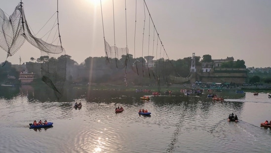 Days after it was reopened following renovation, the suspension bridge on the Machchu river in Morbi town collapsed on October 30, killing 135 people. (PTI)