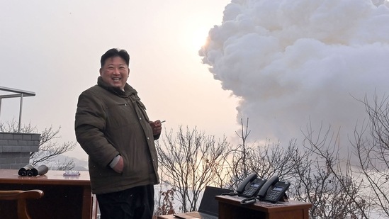 North Korea's leader Kim Jong Un as he directs a ground ejection test - a high-power solid fuel engine test - conducted at the Saikai satellite launch site in South Pyongan Province. (Photo by KCNA VIA KNS / AFP)