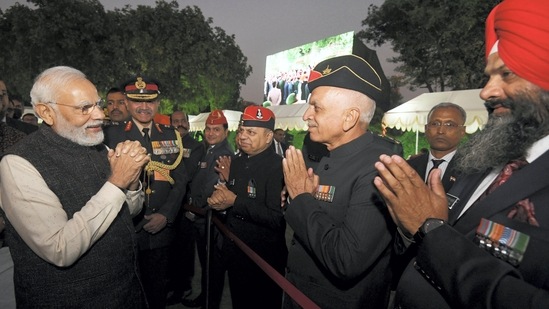 Prime Minister Narendra Modi meets army veterans during the 'At Home' reception organised on the eve of the Vijay Diwas, at Army House in Delhi on Thursday.(PTI)