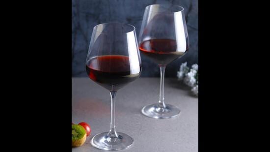 These sleek, smooth, and slim stem, red wine glasses, made with Bohemian crystal feel just as good as they look and can hold over half a litre of your favourite wine. (Santorini wine glasses by Vaaree)