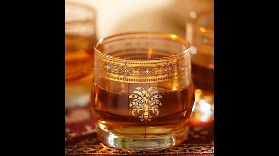 These fine, whiskey glasses will add more style, when you pour your single malts into them. They have an intricate, real gold, geometric and floral design. (24k gold work whiskey glasses by Jaypore)