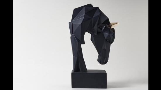 This stunning geometric horse, which has been crafted in fibre will certainly add a powerful and masculine feel to your coffee table or desk. (Geo Horse sculpture in black & gold by htohshop)