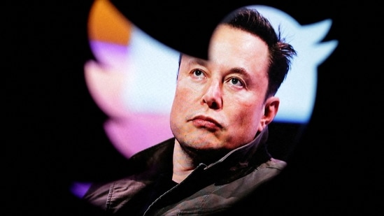 Elon Musk's photo is seen through a Twitter logo in this illustration. (REUTERS)