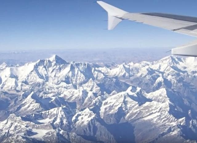 Within 10 minutes of take-off, the mountains appeared, and stayed in view until the plane banked left around Siliguri to turn towards its destination Within 10 minutes of take-off, the mountains appeared, and stayed in view until the plane banked left around Siliguri to turn towards its destination