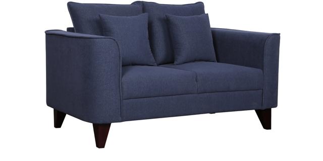 This eye catching navy blue, fabric based, two seater sofa with a cushioned backrest and tapered wooden legs is perfect for your man pad. It has a simple, timeless design and is a perfect blend of functionality and aesthetics. (Lara two seater sofa by CasaCraft on Pepperfry)