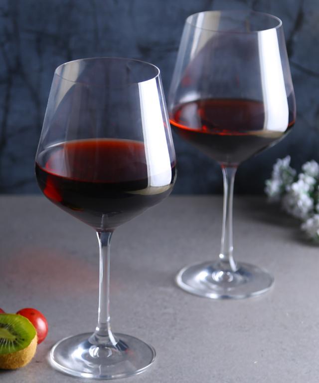 These sleek, smooth, and slim stem, red wine glasses, made with Bohemian crystal feel just as good as they look and can hold over half a litre of your favourite wine. (Santorini wine glasses by Vaaree)