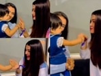 Actor Aishwarya Rai Bachchan in a cute moment with a young fan. Actor Aishwarya Rai Bachchan in a cute moment with a young fan.