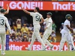 Australia's Mitchell Starc, centre, is congratulated by teammates after taking the wicket of South Africa's Temba Bavuma, right, during the first cricket test between South Africa and Australia at the Gabba in Brisbane, Australia, Saturday, Dec.17, 2022. (AP) Australia's Mitchell Starc, centre, is congratulated by teammates after taking the wicket of South Africa's Temba Bavuma, right, during the first cricket test between South Africa and Australia at the Gabba in Brisbane, Australia, Saturday, Dec.17, 2022. (AP)