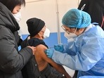An elderly man receives a Covid-19 vaccine in Qingzhou in China's eastern Shandong province on December 16.