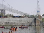 Days after it was reopened following renovation, the suspension bridge on the Machchu river in Morbi town collapsed on October 30, killing 135 people. (AP) Days after it was reopened following renovation, the suspension bridge on the Machchu river in Morbi town collapsed on October 30, killing 135 people. (AP)