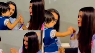 Actor Aishwarya Rai Bachchan in a cute moment with a young fan. Actor Aishwarya Rai Bachchan in a cute moment with a young fan.