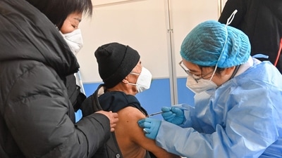 An elderly man receives a Covid-19 vaccine in Qingzhou in China's eastern Shandong province on December 16. (AFP) An elderly man receives a Covid-19 vaccine in Qingzhou in China's eastern Shandong province on December 16. (AFP)