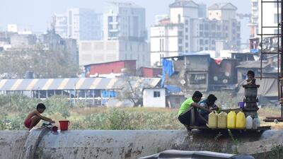 Mumbai, India - November 19, 2022: Water being illegally filled in cans from the valve of Tulsi water pipeline in the afternoon, at Bandra, in Mumbai, India, on Saturday, November 19, 2022. (Photo by Vijay Bate/HT Photo) (HT PHOTO) Mumbai, India - November 19, 2022: Water being illegally filled in cans from the valve of Tulsi water pipeline in the afternoon, at Bandra, in Mumbai, India, on Saturday, November 19, 2022. (Photo by Vijay Bate/HT Photo) (HT PHOTO)