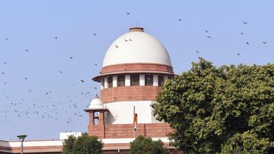 New Delhi, Nov 11 (ANI): A flock of birds passes by the complex of the Supreme Court of India, in New Delhi on Friday. (ANI Photo) (Shrikant Singh) New Delhi, Nov 11 (ANI): A flock of birds passes by the complex of the Supreme Court of India, in New Delhi on Friday. (ANI Photo) (Shrikant Singh)