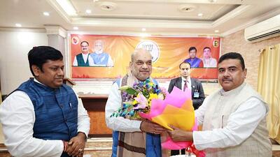 Union home minister Amit Shah being welcomed by Leader of Opposition in West Bengal Assembly Suvendu Adhikari during a meeting with the West Bengal BJP core group and other senior leaders, in Kolkata. (ANI) Union home minister Amit Shah being welcomed by Leader of Opposition in West Bengal Assembly Suvendu Adhikari during a meeting with the West Bengal BJP core group and other senior leaders, in Kolkata. (ANI)