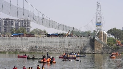 Days after it was reopened following renovation, the suspension bridge on the Machchu river in Morbi town collapsed on October 30, killing 135 people. (AP) Days after it was reopened following renovation, the suspension bridge on the Machchu river in Morbi town collapsed on October 30, killing 135 people. (AP)