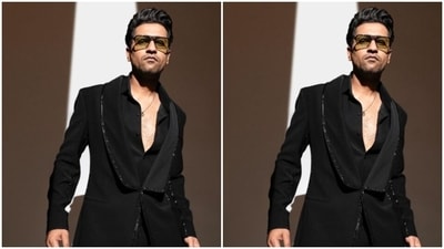 Here’s a picture of Vicky looking ravishing in a black shirt, buttoned down to his chest, layered with a black coat, with black sequin details at the borders. (Instagram/@vickykaushal09) Here’s a picture of Vicky looking ravishing in a black shirt, buttoned down to his chest, layered with a black coat, with black sequin details at the borders. (Instagram/@vickykaushal09)