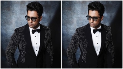 A little sequin can never go wrong. The actor picked a white shirt and added a black bow to it. He further layered it with a black blazer, designed in silver sequins in vertical stripes. (Instagram/@vickykaushal09) A little sequin can never go wrong. The actor picked a white shirt and added a black bow to it. He further layered it with a black blazer, designed in silver sequins in vertical stripes. (Instagram/@vickykaushal09)