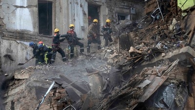 Ukrainian State Emergency Service firefighters clear the rubble at the building which was destroyed by a Russian attack in Kryvyi Rih, Ukraine, Friday, December 16, 2022. (AP/PTI) Ukrainian State Emergency Service firefighters clear the rubble at the building which was destroyed by a Russian attack in Kryvyi Rih, Ukraine, Friday, December 16, 2022. (AP/PTI)